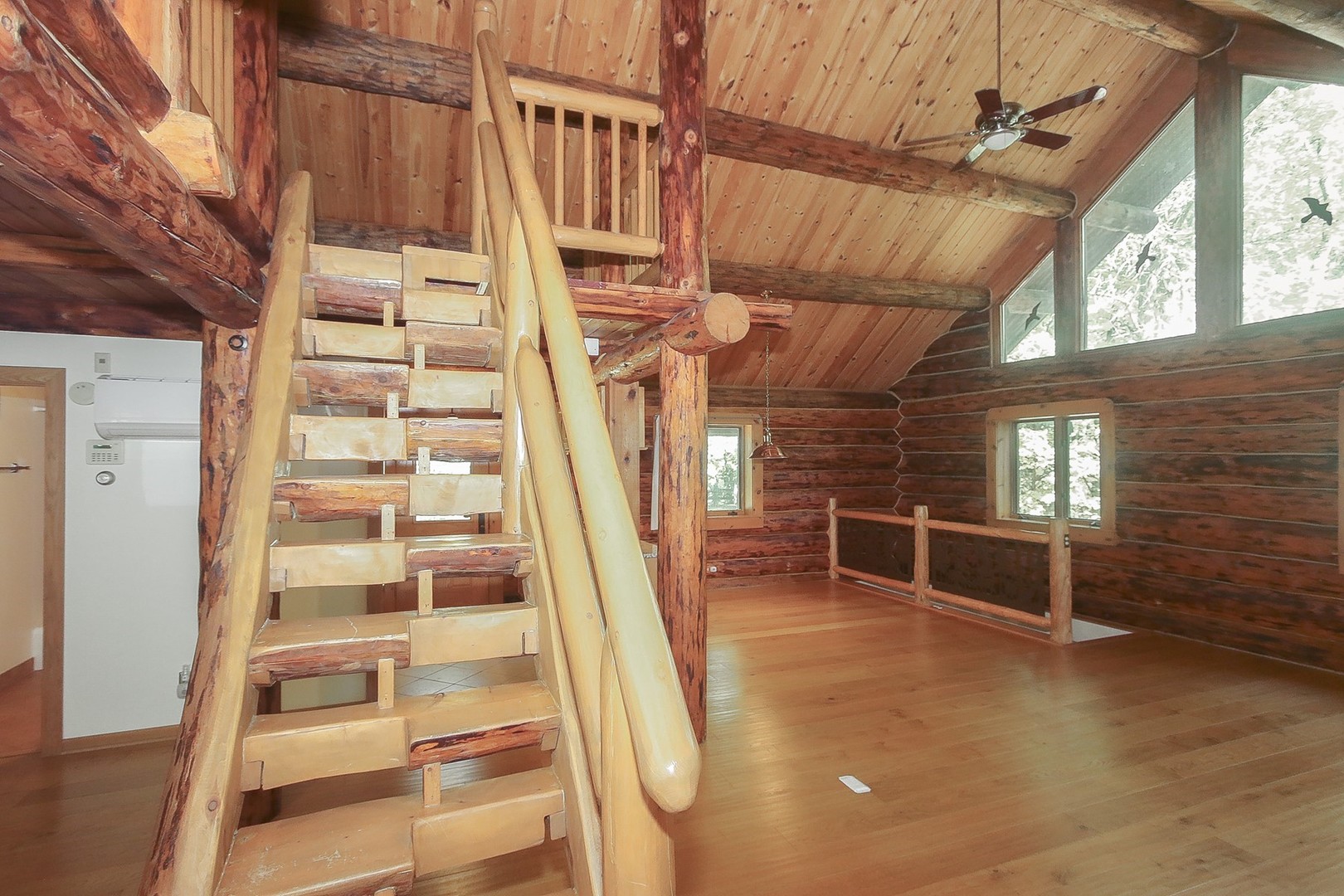 8108 Crystal Springs Road Bull Valley, IL 60098 - Photo 3 of 33 a view of staircase with white walls and windows