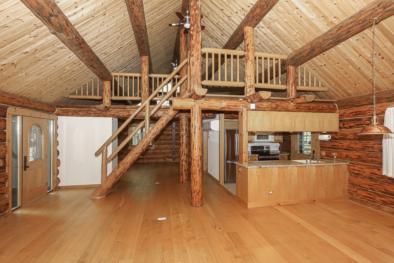 8108 Crystal Springs Road Bull Valley, IL 60098 - Photo 9 of 33 a view of entryway and hall with wooden floor