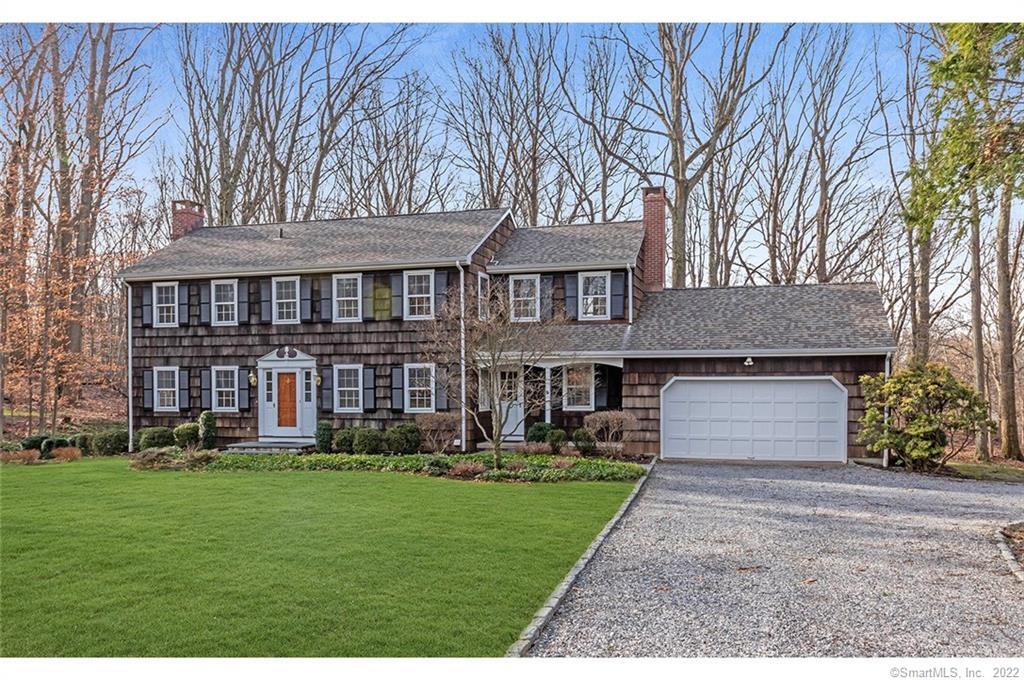 243 Sturbridge Lane Fairfield, CT 06890 - Photo 1 of 1 a front view of house with yard and green space