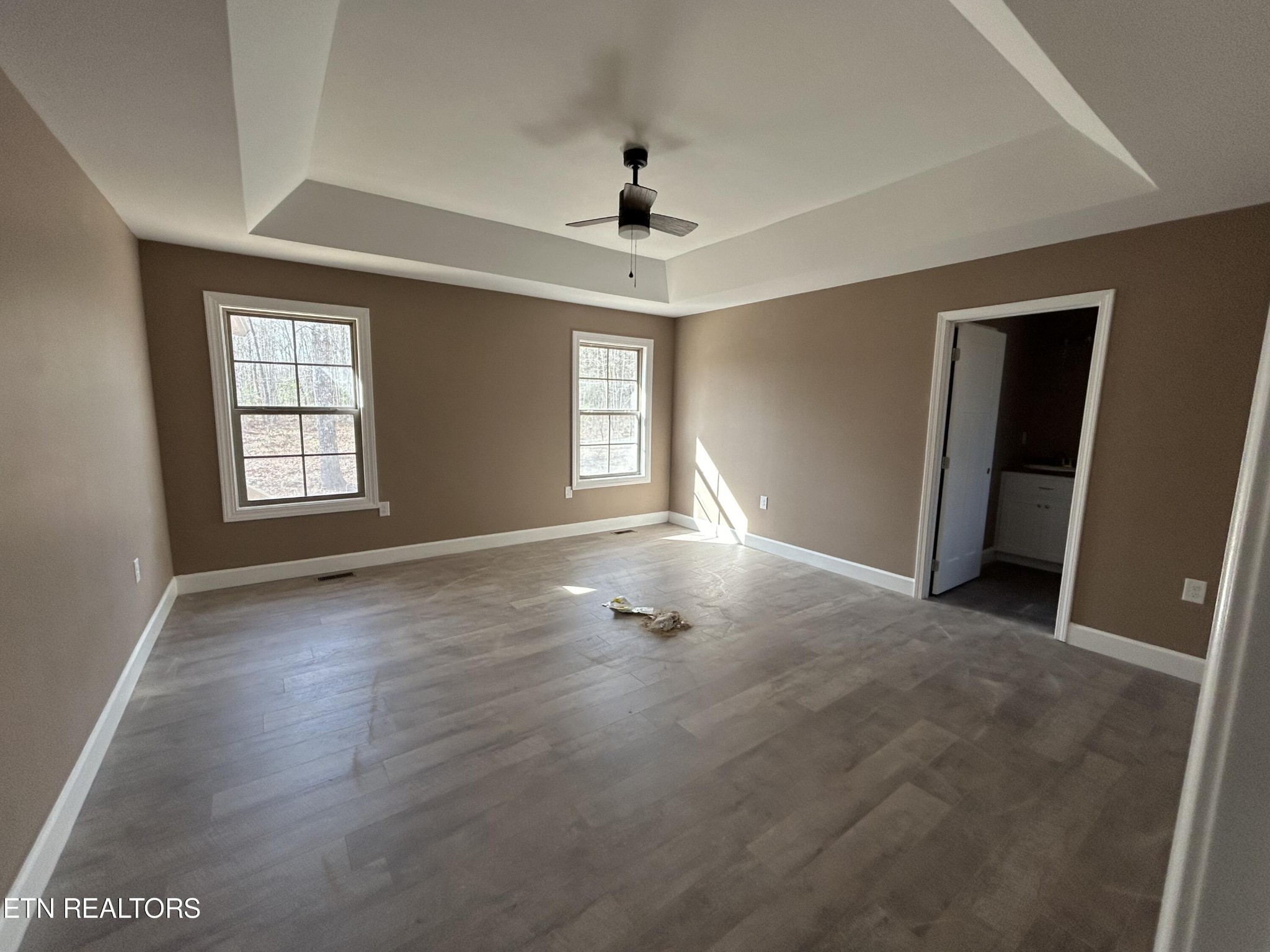 162 Jay Loop Jamestown, TN 38556 - Photo 13 of 15 an empty room with wooden floor and windows