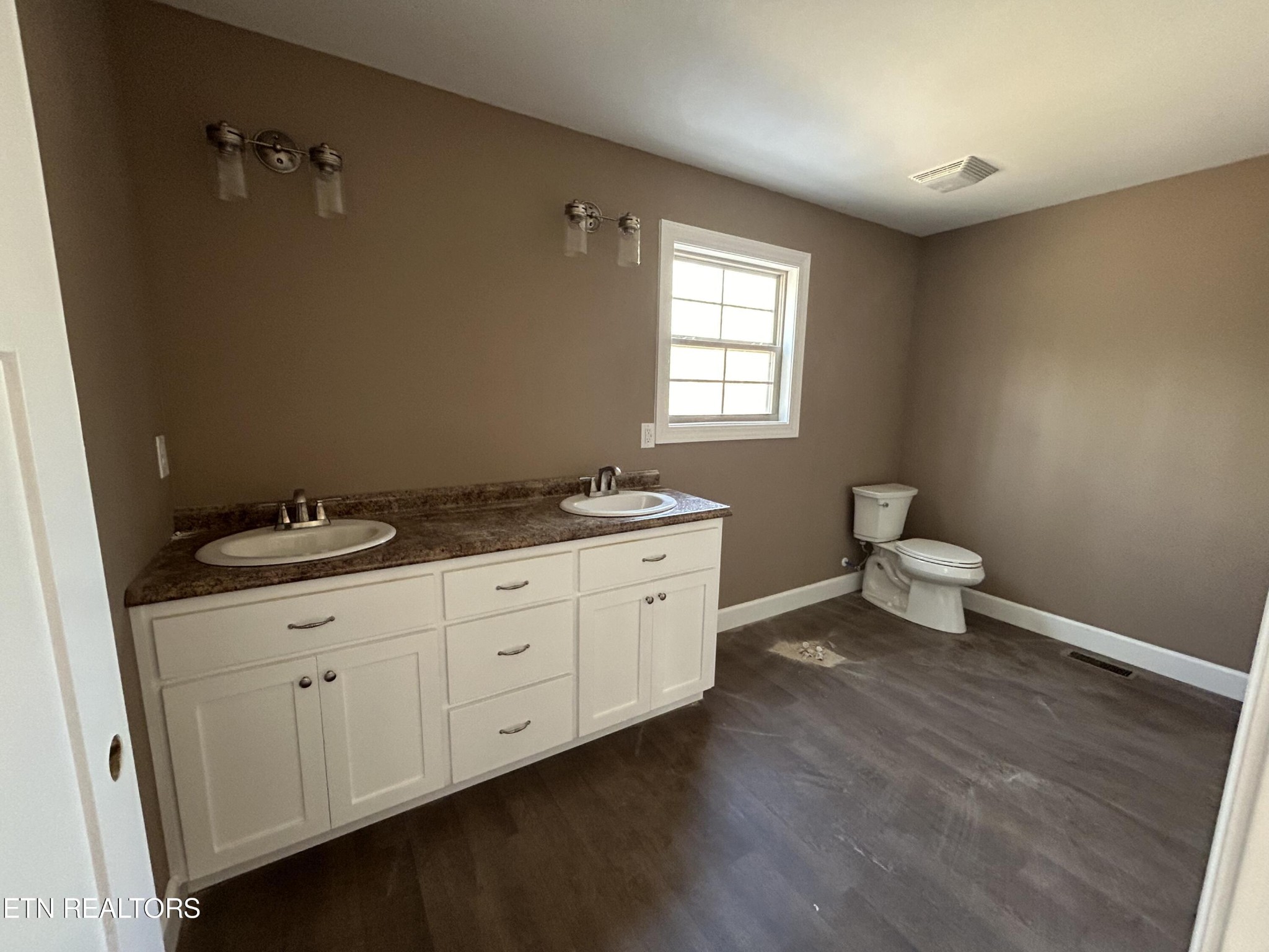 162 Jay Loop Jamestown, TN 38556 - Photo 14 of 15 a spacious bathroom with a granite countertop sink toilet and view