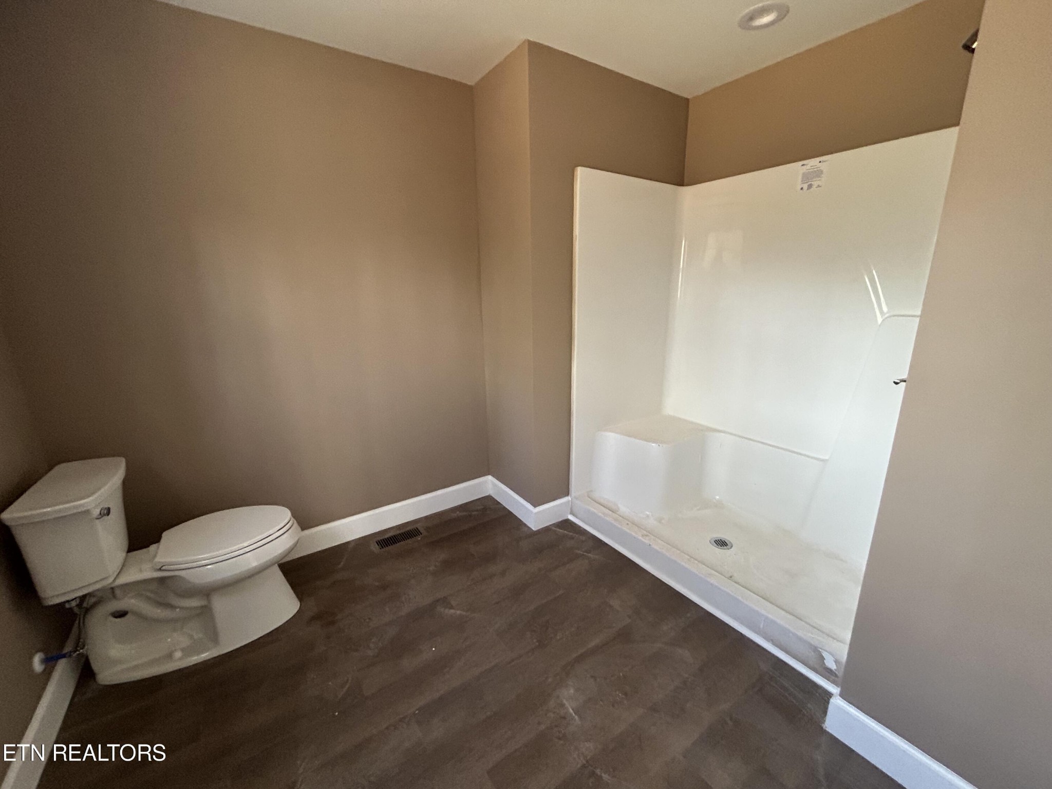 162 Jay Loop Jamestown, TN 38556 - Photo 15 of 15 a bathroom with a toilet and a shower