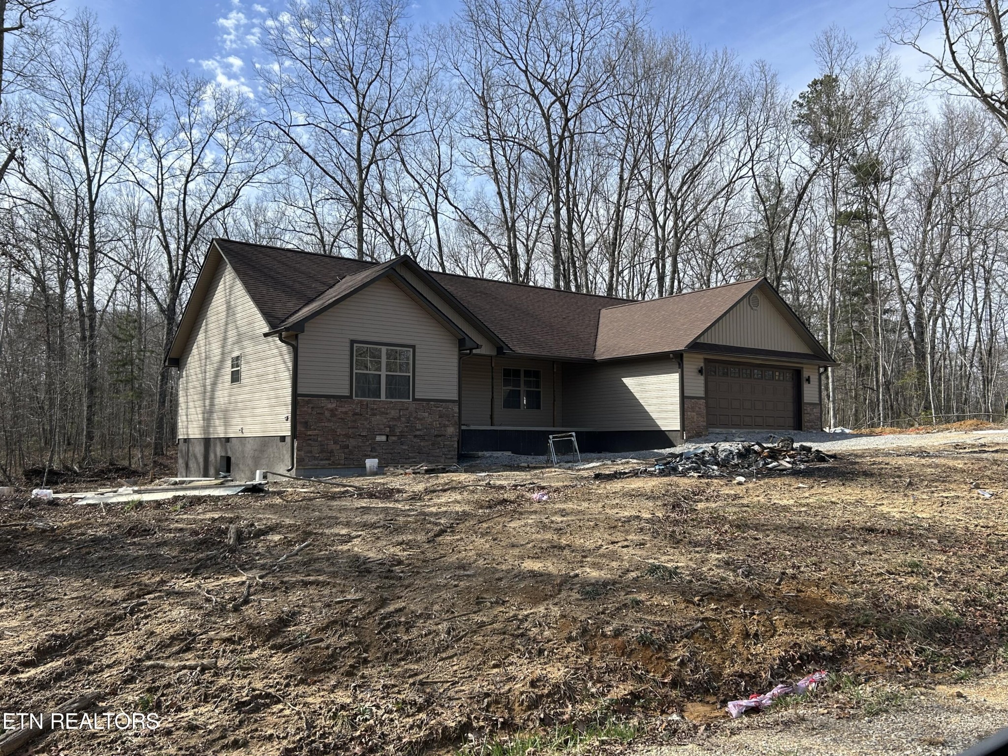 162 Jay Loop Jamestown, TN 38556 - Photo 2 of 15 a house with trees in the background