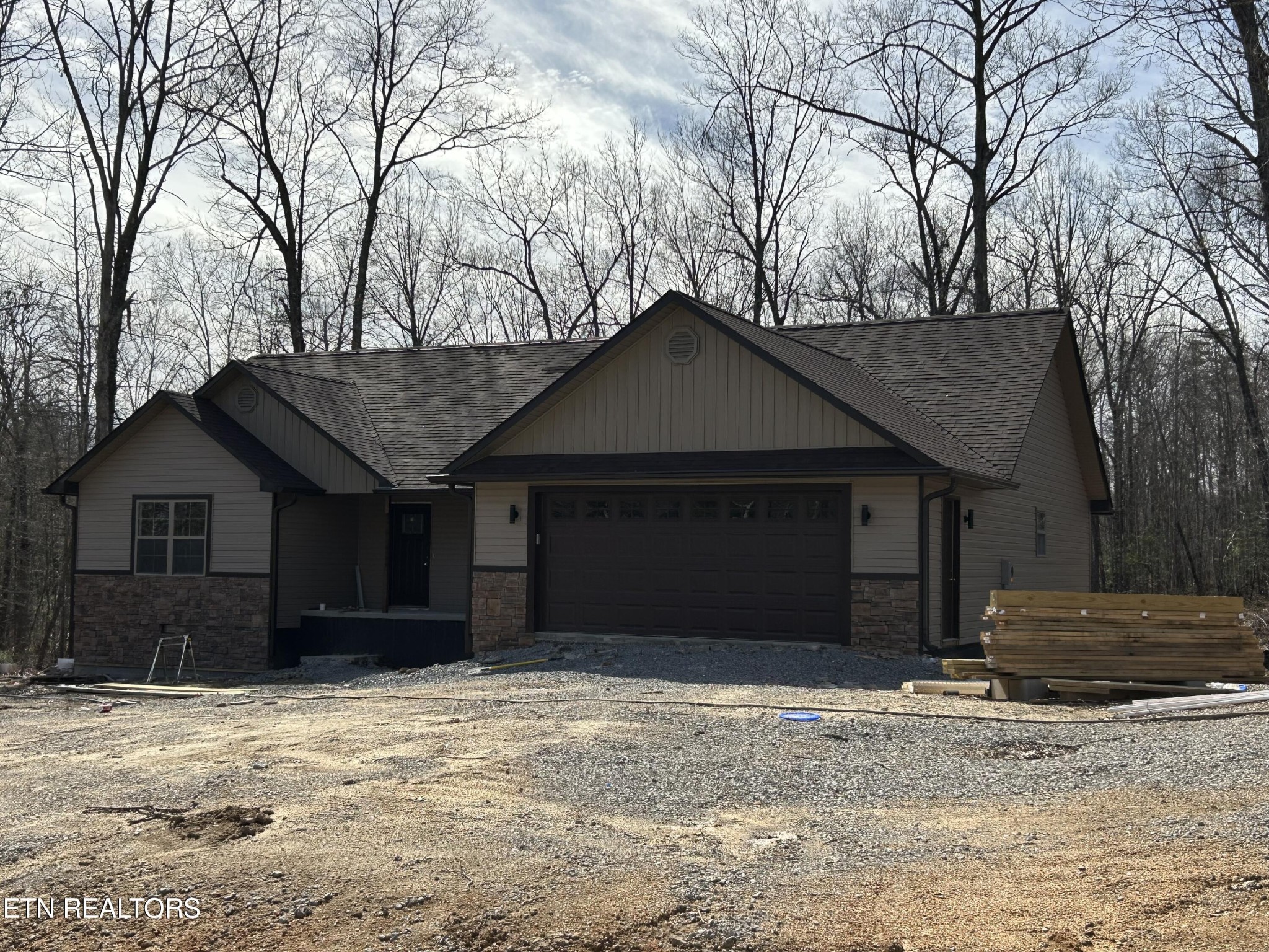 162 Jay Loop Jamestown, TN 38556 - Photo 3 of 15 a house with trees in front of it