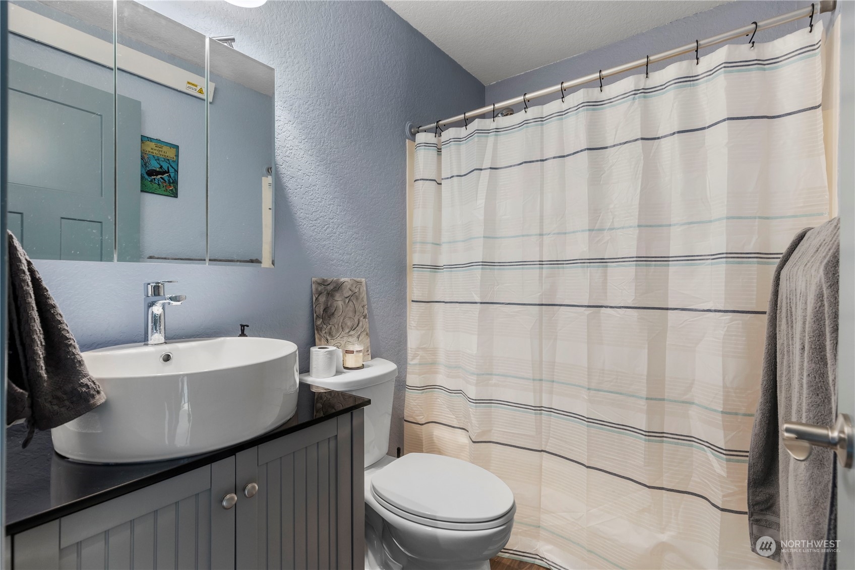 2000 Alabama Street Bellingham, WA 98229 - Photo 11 of 17 a bathroom with a sink a toilet and shower