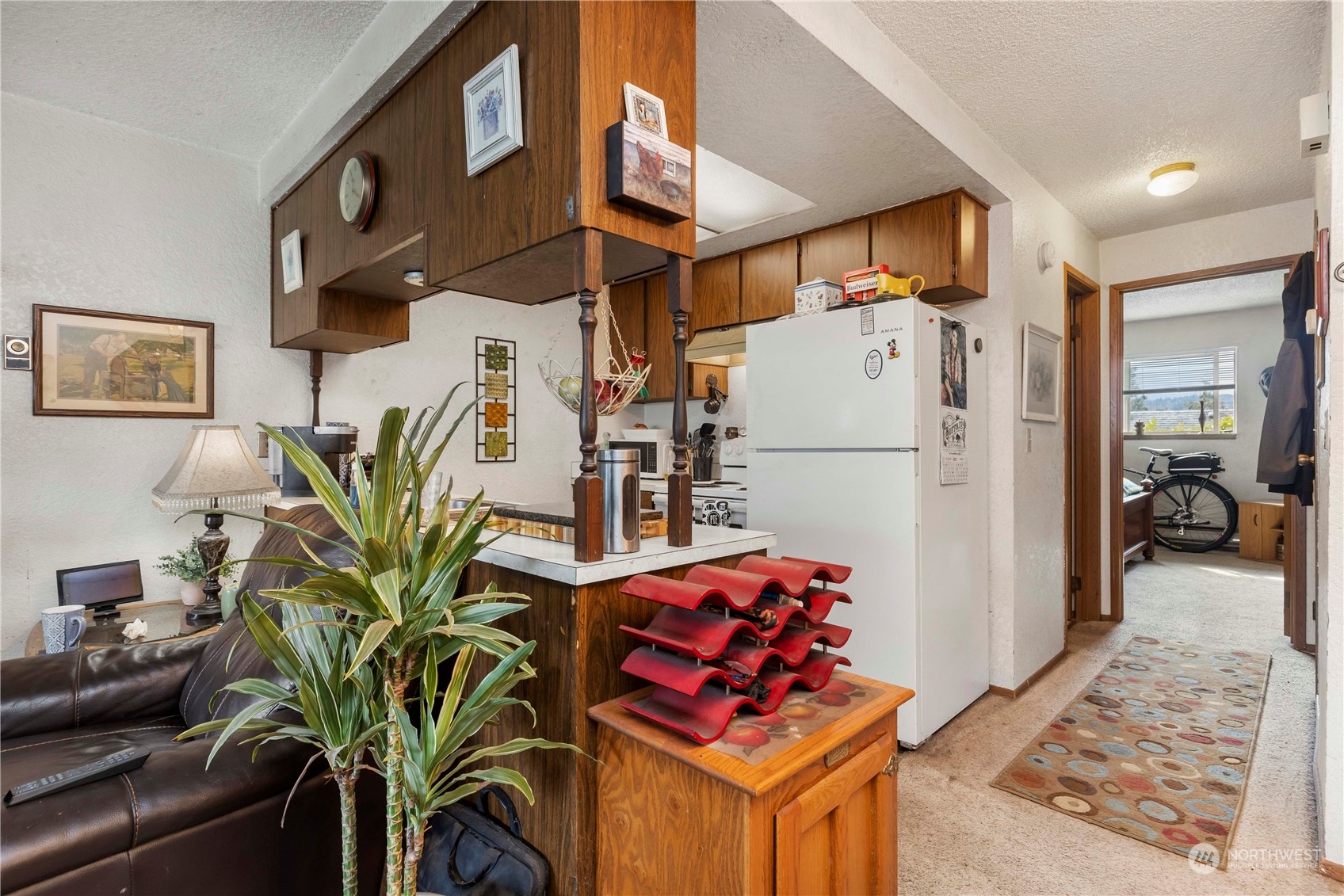 2000 Alabama Street Bellingham, WA 98229 - Photo 14 of 17 a view of a hallway with wooden floor and furniture