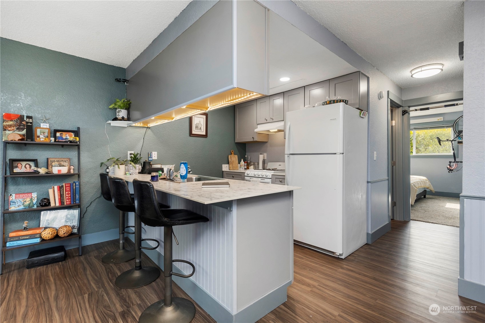 2000 Alabama Street Bellingham, WA 98229 - Photo 9 of 17 a kitchen with stainless steel appliances a sink a refrigerator and wooden floor