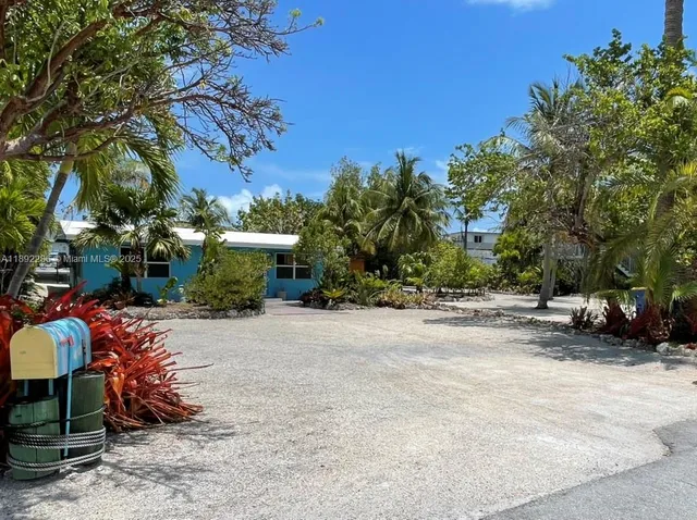 a view of a backyard with a sitting area