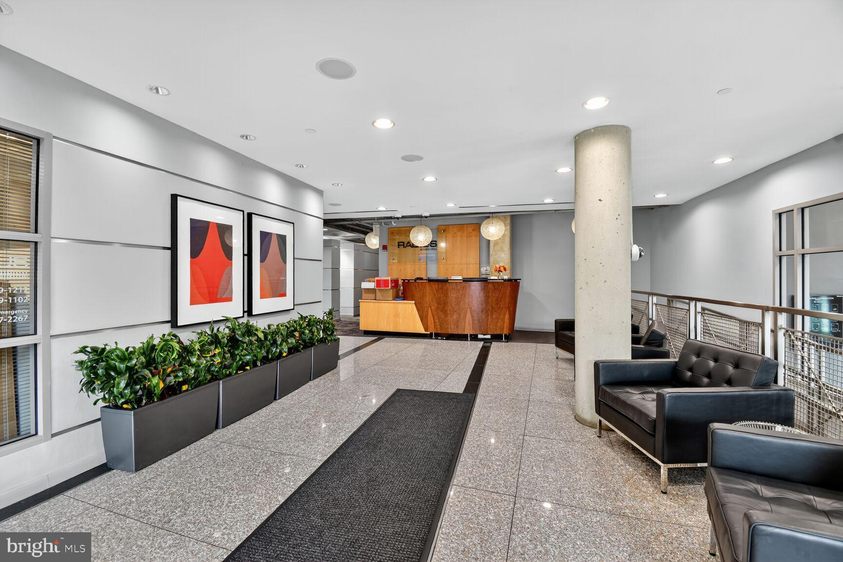 1300 N Street Northwest, Unit 214 Washington, DC 20005 - Photo 3 of 41 a lobby with furniture and potted plant