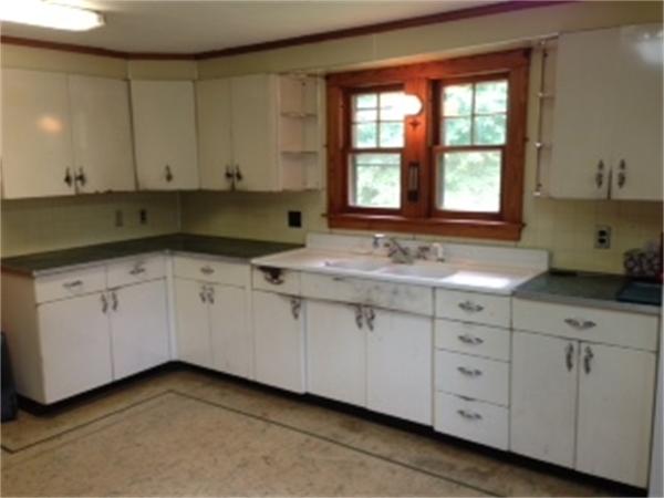 399 Burts Pit Road Northampton, MA 01062 - Photo 2 of 6 a kitchen with granite countertop white cabinets and sink