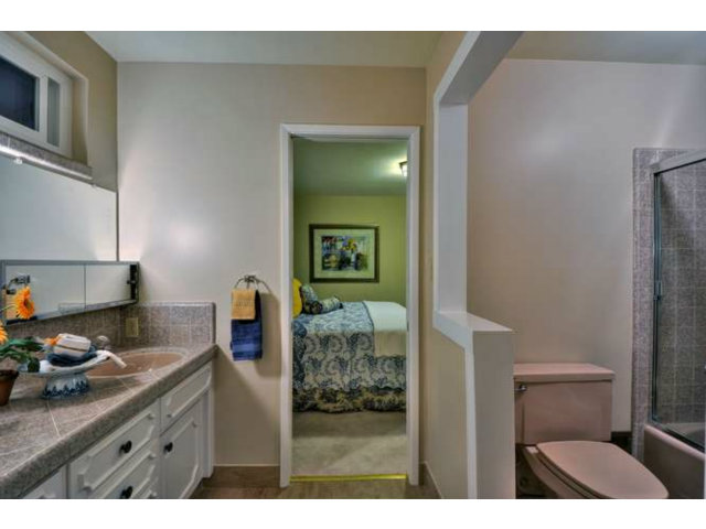15722 Lancaster Road Monte Sereno, CA 95030 - Photo 11 of 23 a en suite bathroom with a granite countertop sink and a mirror