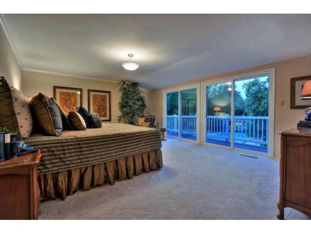 15722 Lancaster Road Monte Sereno, CA 95030 - Photo 12 of 23 a bedroom with a bed and large window