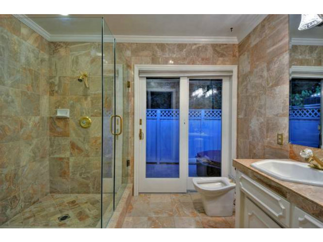 15722 Lancaster Road Monte Sereno, CA 95030 - Photo 14 of 23 a bathroom with a sink a toilet and shower