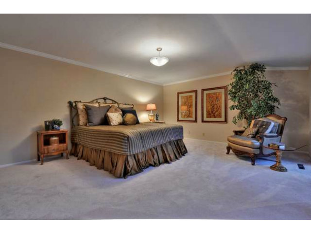 15722 Lancaster Road Monte Sereno, CA 95030 - Photo 15 of 23 a bedroom with furniture and a potted plant