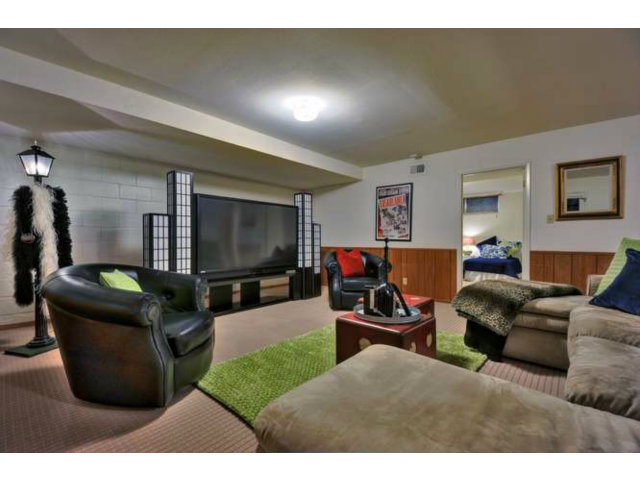 15722 Lancaster Road Monte Sereno, CA 95030 - Photo 16 of 23 a living room with furniture and a flat screen tv