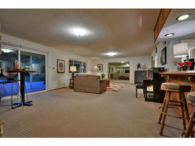 15722 Lancaster Road Monte Sereno, CA 95030 - Photo 17 of 23 a living room with furniture and a table