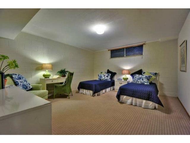 15722 Lancaster Road Monte Sereno, CA 95030 - Photo 20 of 23 a bedroom with furniture and a lamp