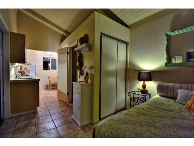 15722 Lancaster Road Monte Sereno, CA 95030 - Photo 22 of 23 a bedroom with a bed and a mirror