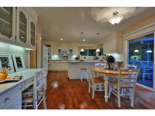15722 Lancaster Road Monte Sereno, CA 95030 - Photo 6 of 23 a dining hall with stainless steel appliances kitchen island a table and chairs