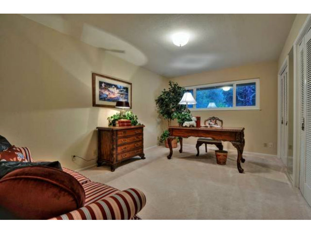 15722 Lancaster Road Monte Sereno, CA 95030 - Photo 9 of 23 a bedroom with a bed and a desk