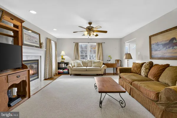 a kitchen with stainless steel appliances granite countertop a stove and white cabinets