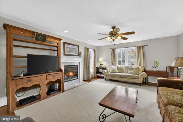 a kitchen with granite countertop white cabinets a sink and dishwasher
