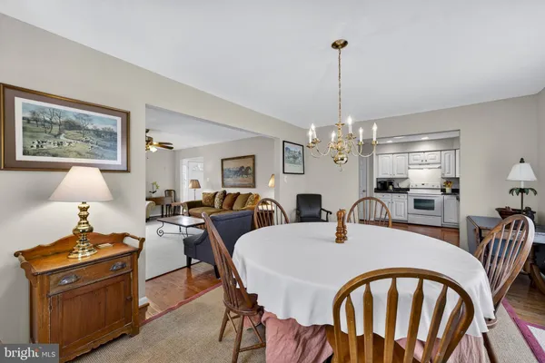a view of a hallway with a livingroom and stairs