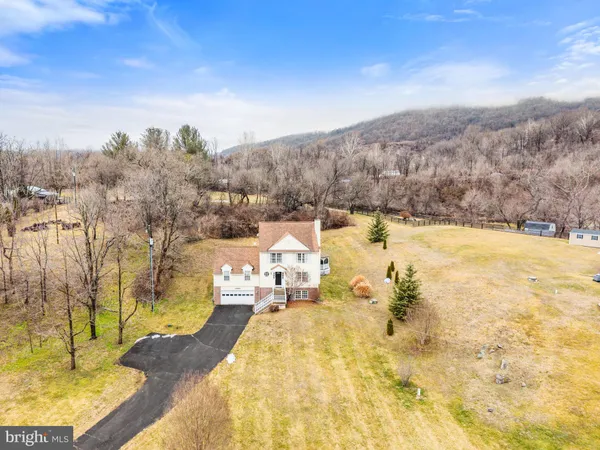a view of large house with a yard