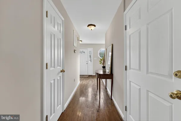 a bathroom with a tub a sink and a mirror