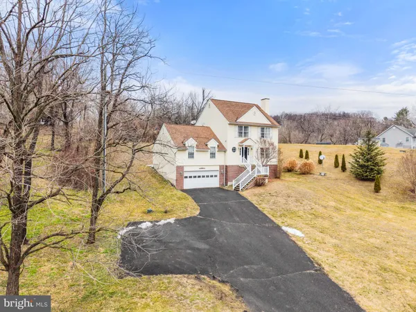 a view of a porch with furniture and a roof deck