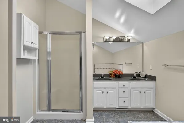 a white toilet sitting next to a bathroom sink