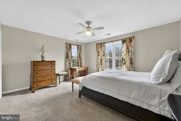 a view of a roof deck with table and chairs with wooden floor and fence