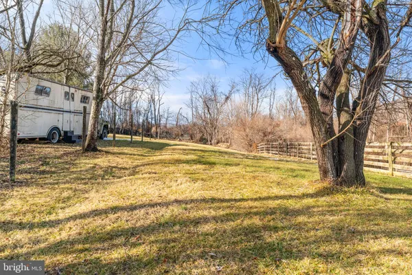 a living room with furniture flat screen tv and a fireplace