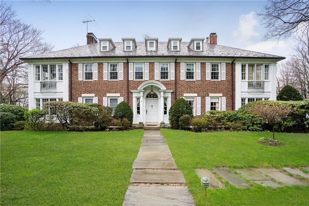 80 Lyncroft Road New Rochelle, NY 10804 - Photo 1 of 1 a front view of a house with a garden and yard