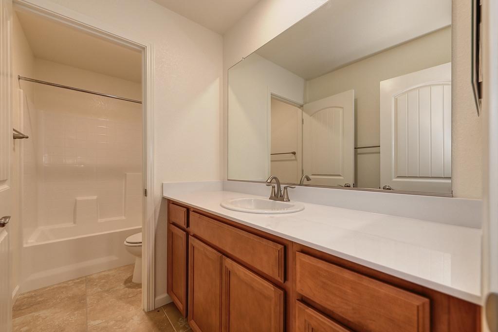 3231 Foxton Way Rancho Cordova, CA 95670 - Photo 18 of 29 a bathroom with a sink and a mirror