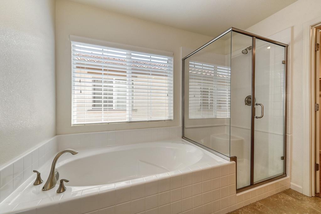 3231 Foxton Way Rancho Cordova, CA 95670 - Photo 24 of 29 a white bath tub sitting next to a window