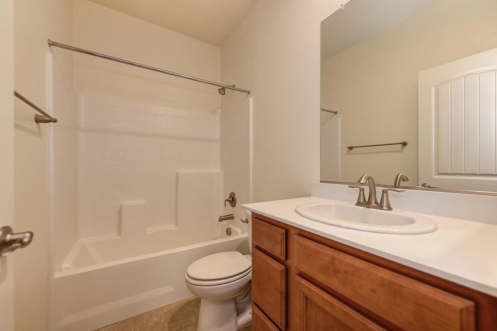 3231 Foxton Way Rancho Cordova, CA 95670 - Photo 5 of 29 a bathroom with a sink a toilet and shower