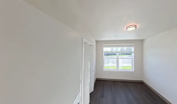 a view of an empty room with a window