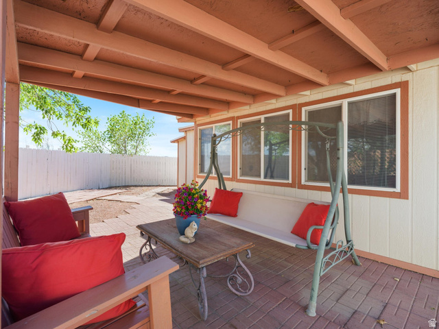 3941 West 40 North Hurricane, UT 84737 - Photo 6 of 55 Covered patio featuring a wood-beam ceiling and brick-patterned flooring