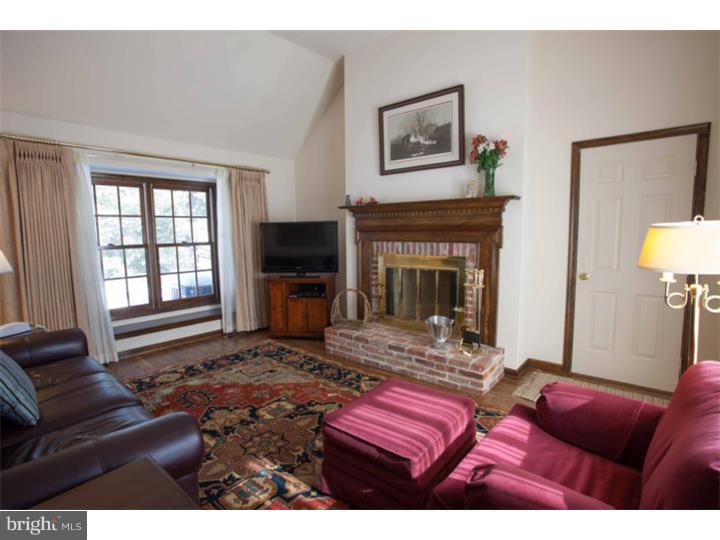 428 Waynesbrooke Road Berwyn, PA 19312 - Photo 17 of 25 a living room with furniture a flat screen tv and a fireplace