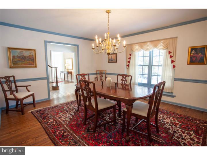 428 Waynesbrooke Road Berwyn, PA 19312 - Photo 7 of 25 a view of a dining room with furniture a chandelier and wooden floor