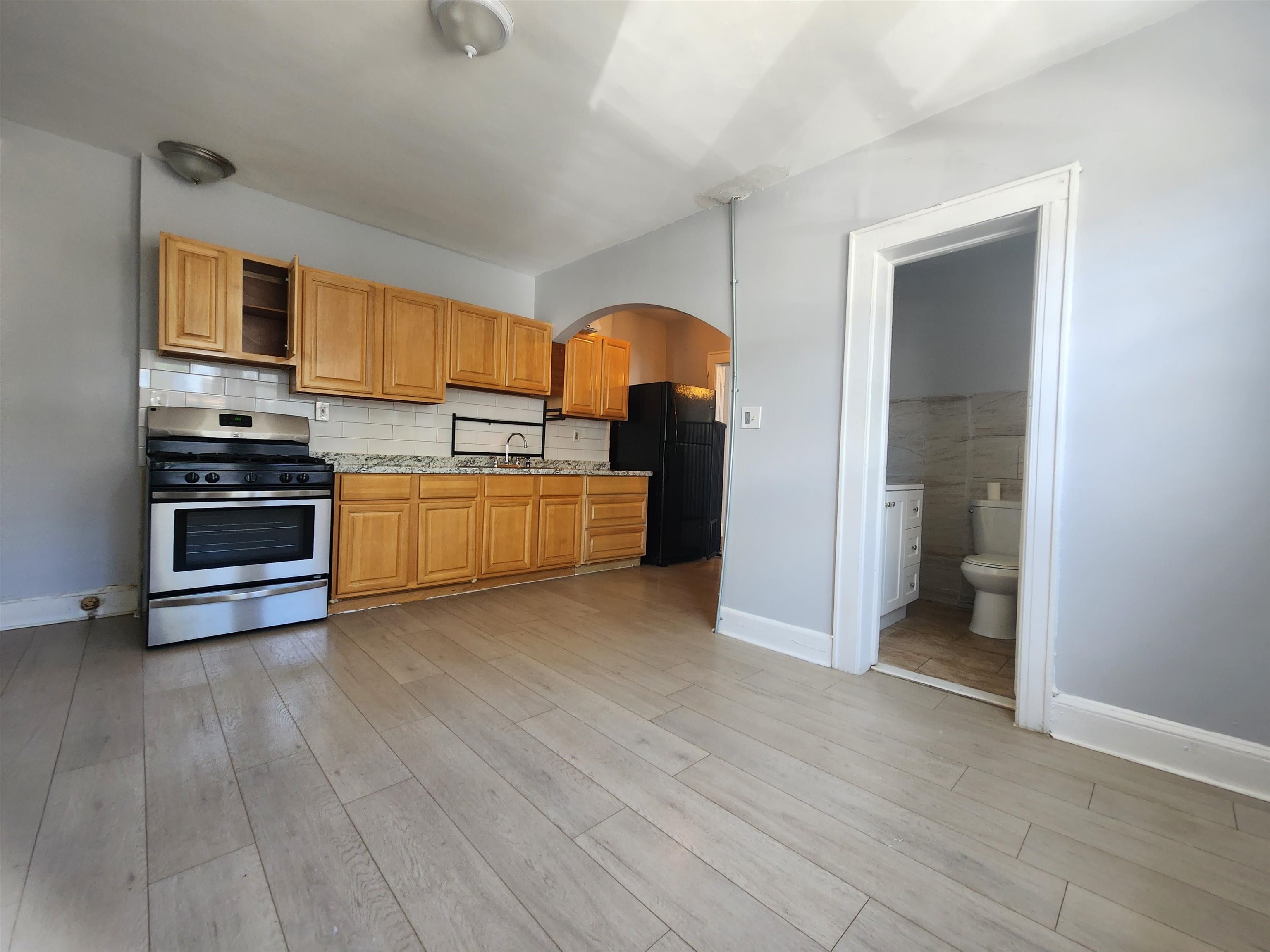261 Centre Avenue, Unit 1 Secaucus, NJ 07094 - Photo 2 of 11 a kitchen with stainless steel appliances granite countertop a stove and a refrigerator