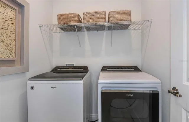 a utility room with dryer and washer