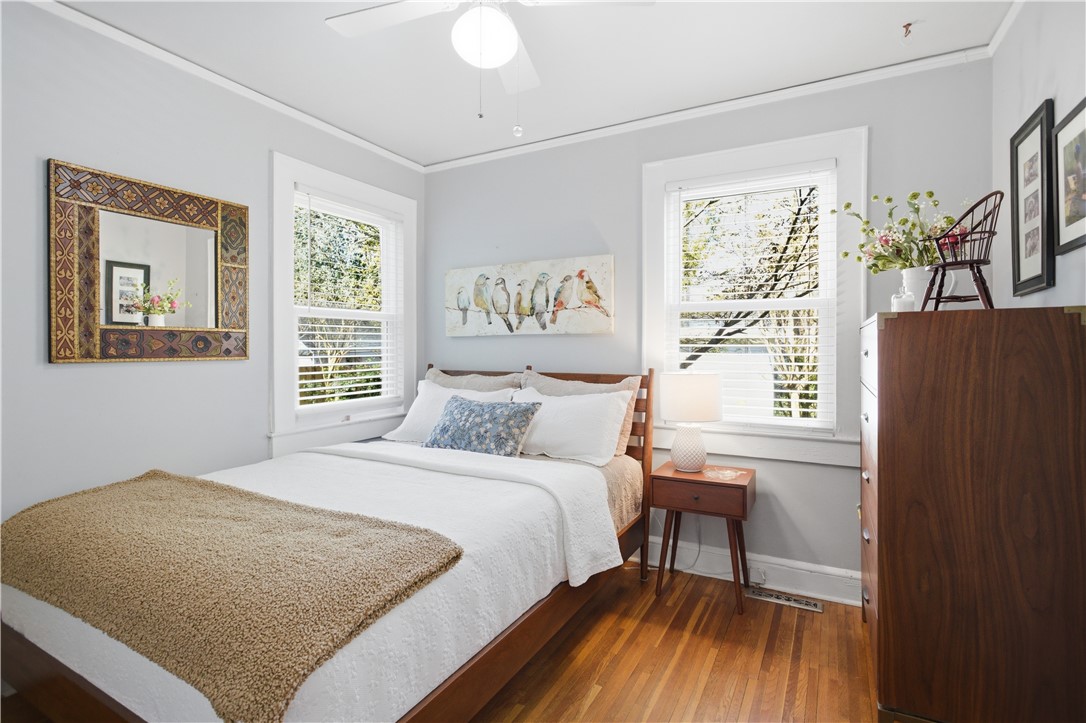 310 Retreat Street Westminster, SC 29693 - Photo 13 of 46 This inviting bedroom features rich hardwood flooring and abundant natural light.