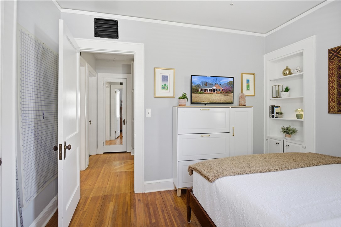 310 Retreat Street Westminster, SC 29693 - Photo 14 of 46 This cozy room offers elegant hardwood flooring, built-in shelving, and ample natural light.