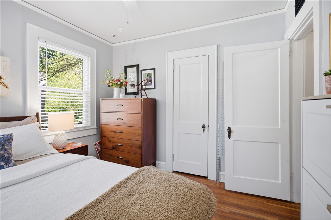 310 Retreat Street Westminster, SC 29693 - Photo 15 of 46 This serene bedroom offers a tranquil retreat with warm wood floors and ample natural light.