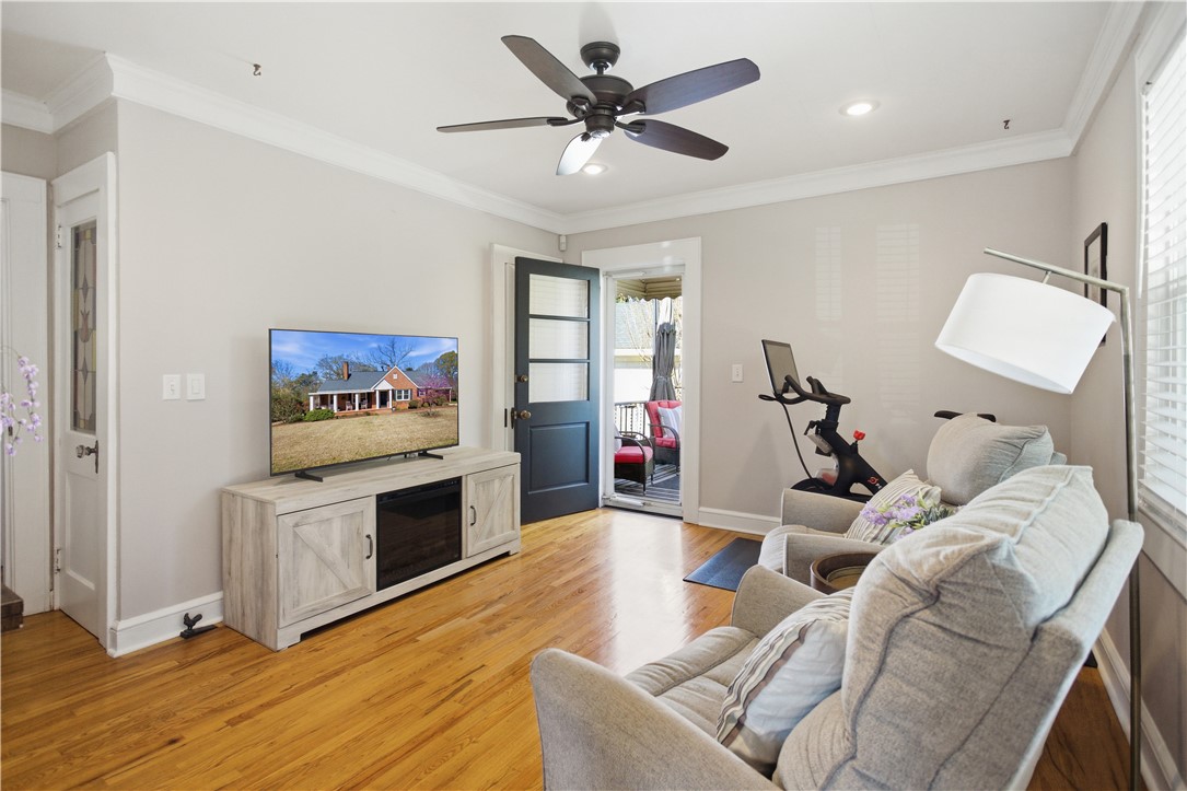 310 Retreat Street Westminster, SC 29693 - Photo 19 of 46 This bright living space features polished hardwood floors and direct access to an outdoor area.