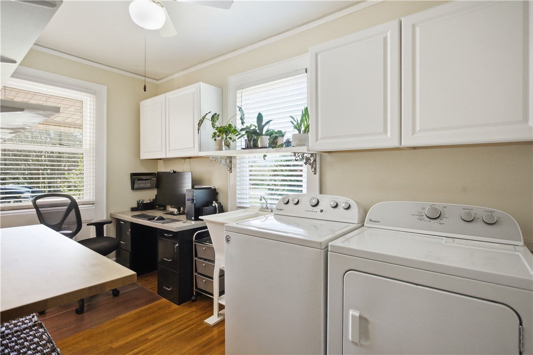 310 Retreat Street Westminster, SC 29693 - Photo 22 of 46 This spacious laundry room features a convenient sink and ample cabinetry for storage and organization.