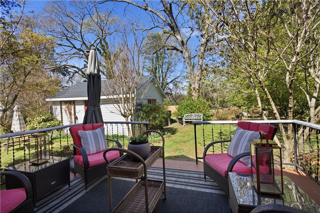 310 Retreat Street Westminster, SC 29693 - Photo 25 of 46 This inviting porch overlooks a lush yard, perfect for tranquil outdoor moments.
