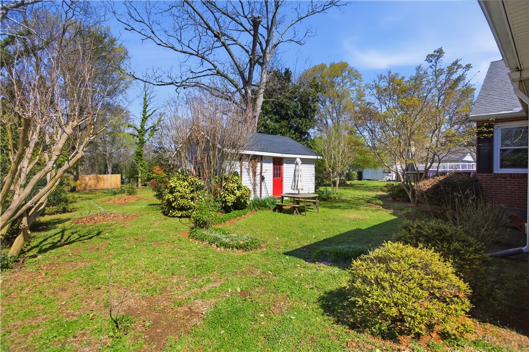 310 Retreat Street Westminster, SC 29693 - Photo 32 of 46 This verdant backyard provides ample green space and a charming shed for additional storage.
